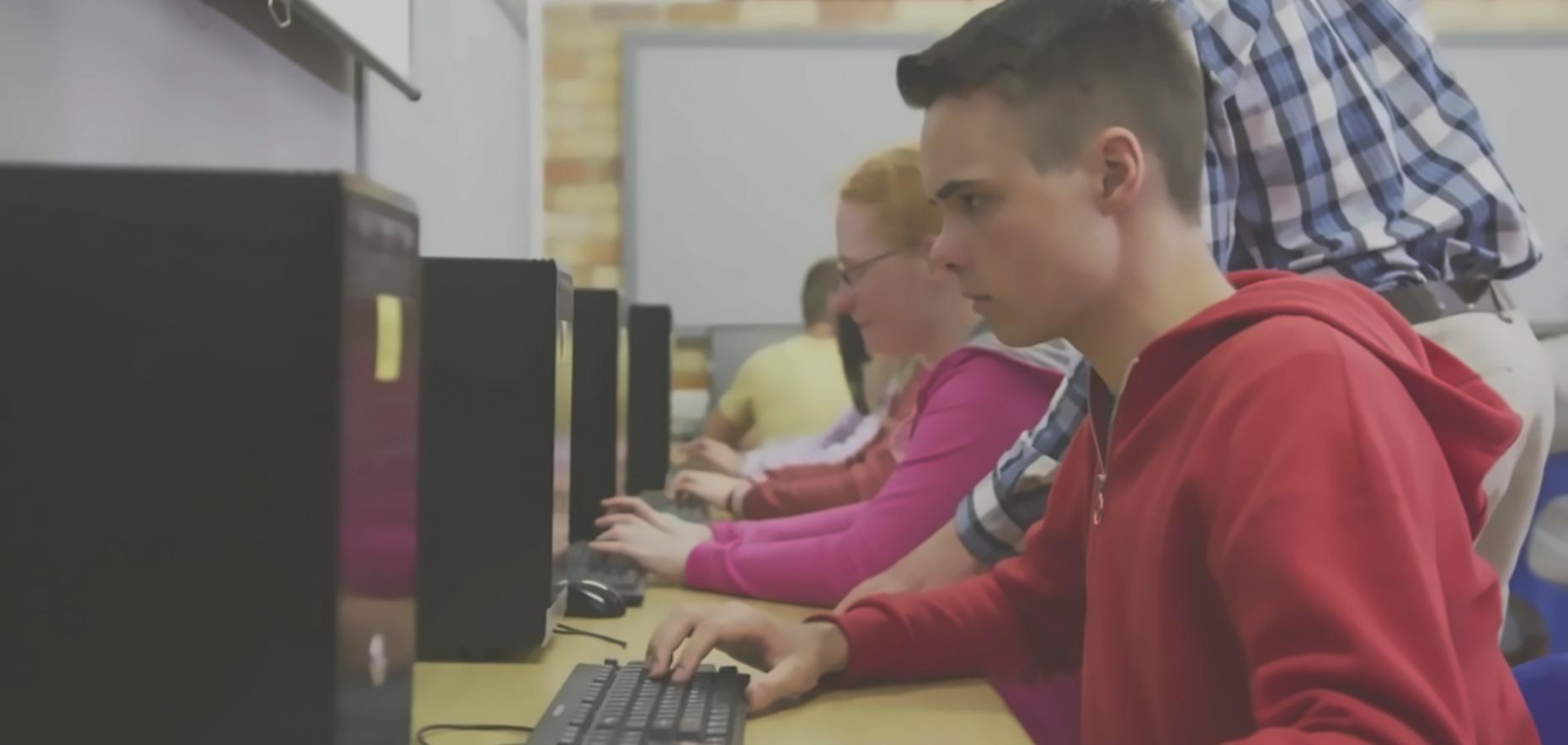 Students collaborating on mobile game development project